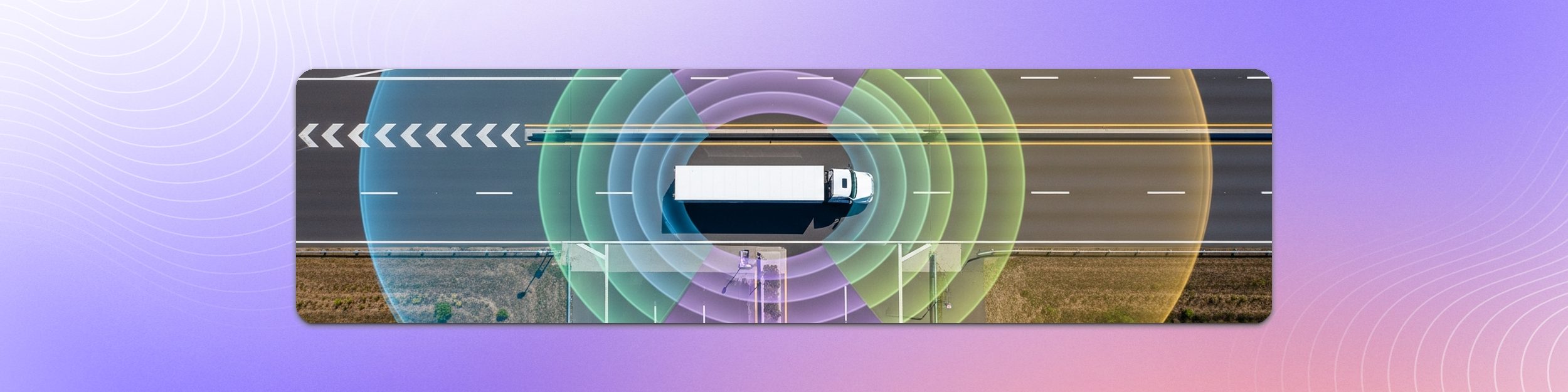 Aerial view of an autonomous truck with multi-LiDAR sensor coverage radiating across the highway