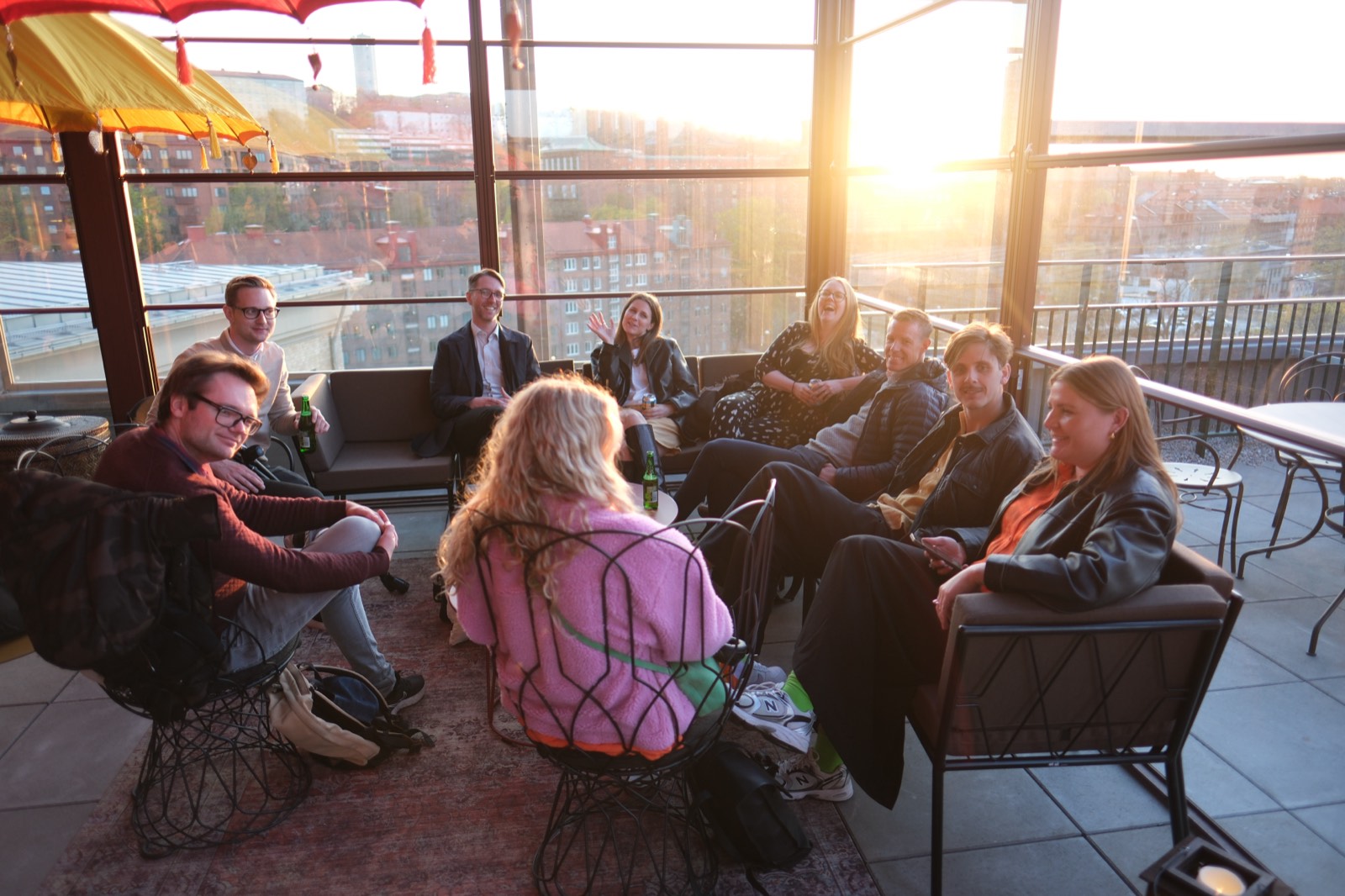 Colleagues on the rooftop terrace at sunset