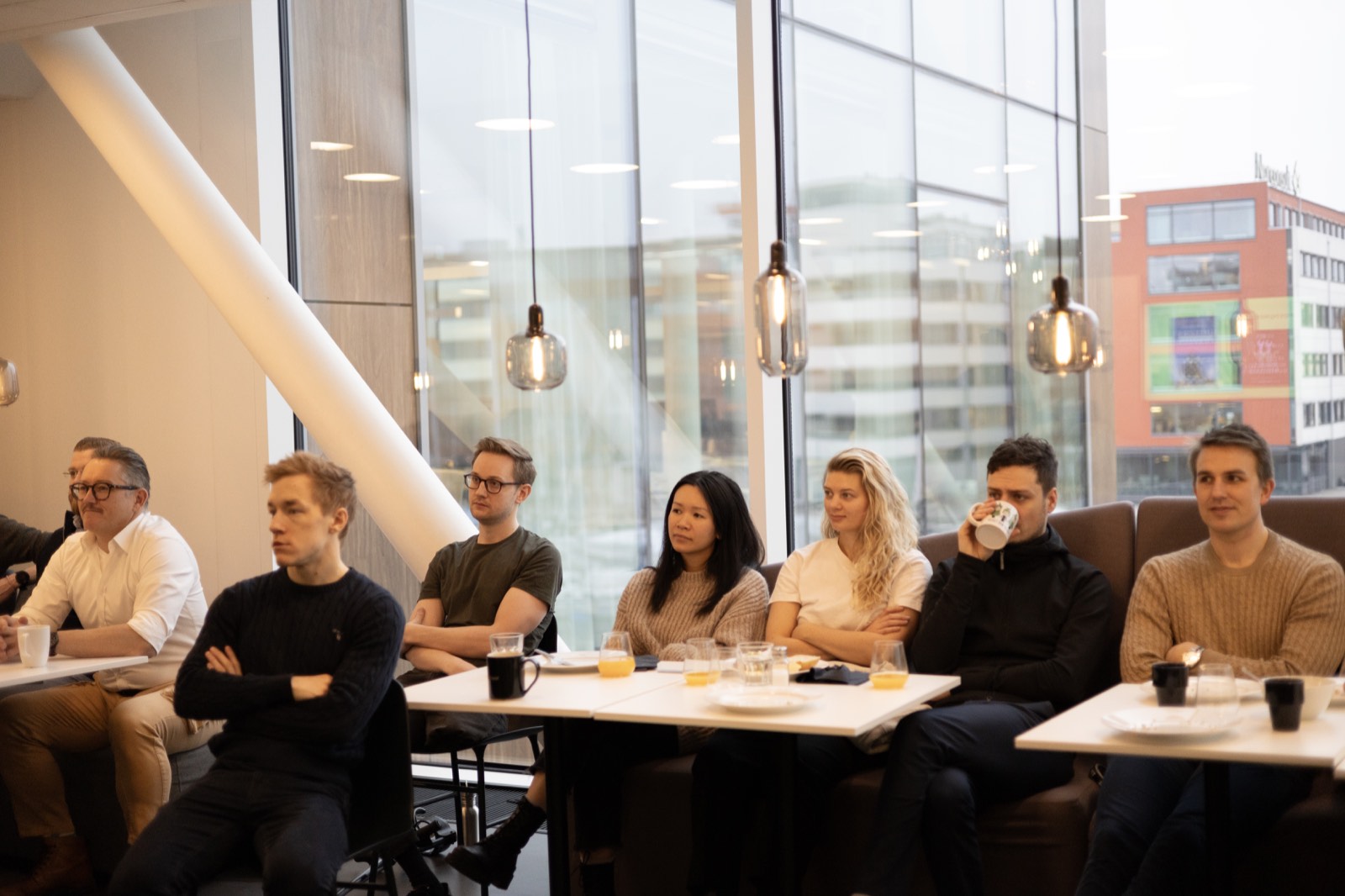 Team listening together at a company gathering