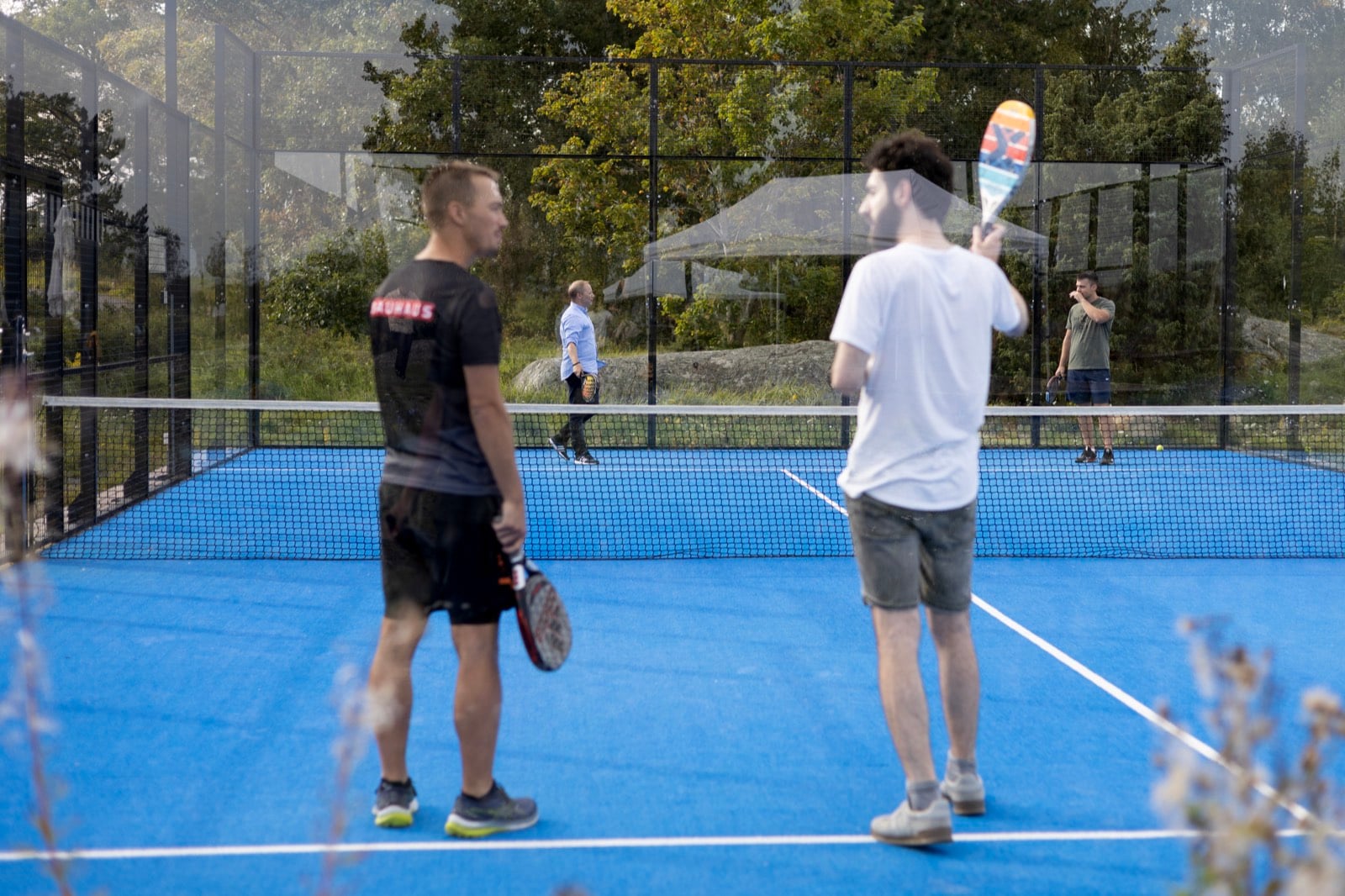 Colleagues playing padel after work